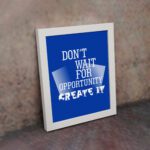 Infidu motivational quotes wall art featuring Don’t Wait For Opportunity, Create It on a blue background and white frame on the wall. inspire your workspace