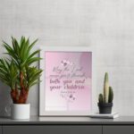 Christian wall art with the verse May The Lord Cause You To Flourish Both You And Your Children Psalm 115:14 in soft colors and floral design. displayed on the table in a white frame