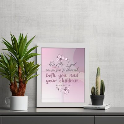 Christian wall art with the verse May The Lord Cause You To Flourish Both You And Your Children Psalm 115:14 in soft colors and floral design. displayed on the table in a white frame