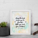 Christian wall art featuring Psalm 115:14 in black cursive on a pastel watercolor background with floral designs. displayed on the wall in a white frame