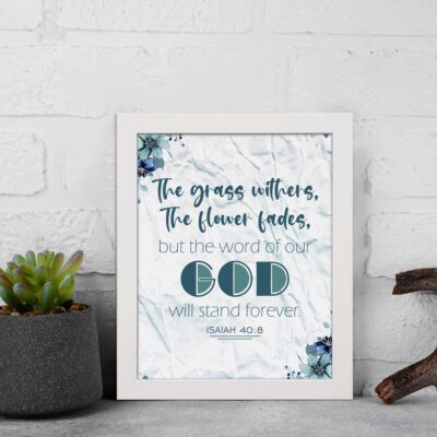 Christian wall art with the verse from Isaiah 40:8, featuring floral details and a textured white background. displayed on the wall in a white frame