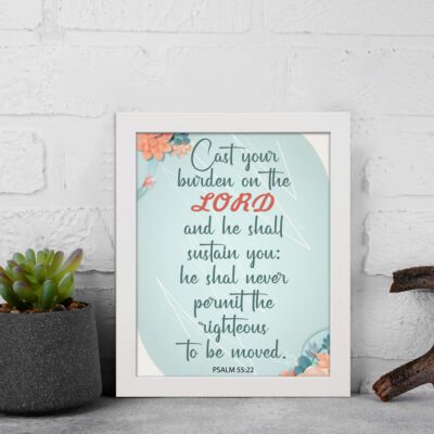 Cast Your Burden on the Lord Psalm 55:22 Christian wall art with teal and coral text on a mint green background with floral accents. displayed on the wall in a white frame