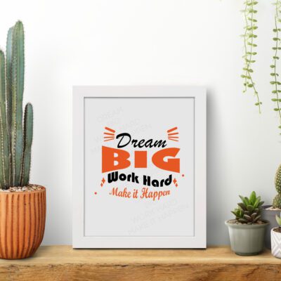 Infidu Dream Big Work Hard Make It Happen wall art with a gray background black and orange text and a white frame on the table. Inspiring decor for home offices and workspaces.