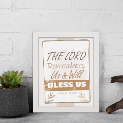 Infidu The Lord Remembers Us And Will Bless Us Psalm 115:12 Bible wall art with elegant text and plant border. displayed on the wall in a white frame