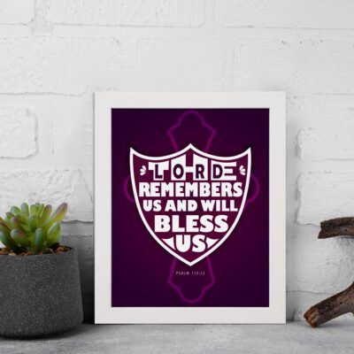 The Lord Remembers Us and Will Bless Us Psalm 115:12 Bible Verse Wall Art in bold white text on a deep purple background. displayed on the wall in a white frame