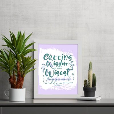 Christian wall art with Getting Wisdom Is The Wisest Thing You Can Do Proverbs 4:7, green text, light purple background, and decorative swirls. displayed on the table in a white frame