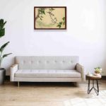 The playful charm of gossiping sparrows in this exquisite vintage art print,hung on the wall above the sofa. with black frame