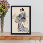 Admire the grace of a Japanese Geisha in this vintage Hokusai art print,kept on a table