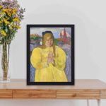 Vintage art print of Paul Gauguin's "Young Christian Girl." kept on a table