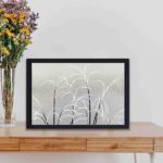 Enhance your decor with this stunning vintage art print of the moon and grasses,displayed on the wall