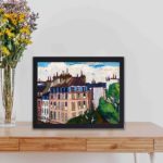 Experience the magic of Paris with this vibrant "Rooftops" art print by Henry Lyman Sayen,displayed on a table with black frame