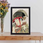 Yoshiwara Suzume art print by Utamaro Kitagawa. Crisp, high-resolution reproduction of classic Japanese beauty, black frame is placed on a table