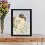 Love with Mary Cassatt's Mother Kiss. High-quality canvas print,displayed on a table with black frame