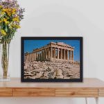 Discover the majesty of the Parthenon with this vintage art print,kept on a table