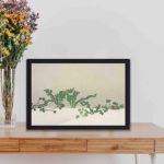 Discover the tranquil beauty of nature with this Kamisaka Sekka green plants art print,kept on a table