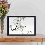 This captivating vintage art print of a white cockatoo perched on a branch,hung on the wall with black frame