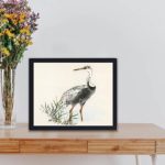 Experience the serenity of nature with this vintage crane art print by Kono Bairei,displayed on a table