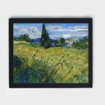 Enchanting beauty of Van Gogh's "Green Wheat Field with Cypress" with this vintage art print,mounted on the wall