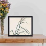 this vintage art print featuring Poaceae by Kono Bairei,placed on the table