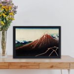 Enhance your decor with this stunning vintage art print of Mount Fuji by Katsushika Hokusai,hung on the wall