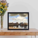 Our framed Vermeer "View of Delft" reproduction,displayed on a table