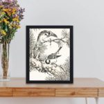 Add the harmony of nature with this Japanese Willow Tit and Pine Tree art print by Numata Kashu,kept on a table