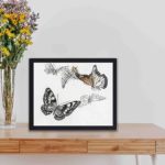 this stunning vintage art print of butterflies by Morimoto Toko,framed and placed on a table