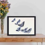 Experience the beauty of Japanese art with this Kamisaka Sekka butterfly woodblock print,displayed on a table