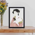 Experience the beauty of Japanese aesthetics with this Goyo Hashiguchi art print,displayed on a table