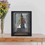 Beauty of Claude Monet's "The Red Kerchief" with this vintage art print,kept on a table