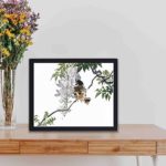 vintage art print of "Sparrow on a Branch" by Kono Bairei, framed and placed on the table