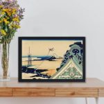 this stunning vintage art print of Toto Asakusa Honganji by Katsushika Hokusai,placed on the table