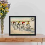 This vintage "Wheelman in A Red Hot Finish" art print by John Cameron,displayed on a table with black frame