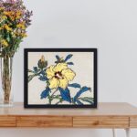 The beauty of a hibiscus flower with this vintage art print by Kono Bairei,displayed on a table