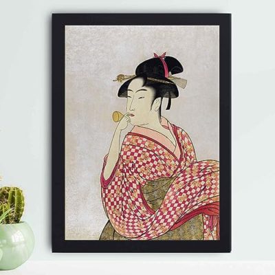 vintage art print features "Poppen o Fuku Musume" by Utamaro Kitagawa, showing a traditional young Japanese woman blowing a glass pipe. hung on the wall