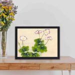 Beauty of Mallow flowers in this exquisite vintage art print,displayed on a table with black frame