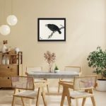 Experience the beauty of nature with this vintage crow art print by Kono Bairei,placed on the wall with black frame