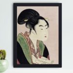 Enhance your decor with this stunning vintage art print of a woman reading a scroll by Utamaro Kitagawa,hung on the wall with black