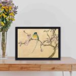 Featuring a delicate bird amidst plum blossoms,kept on a table with black frame