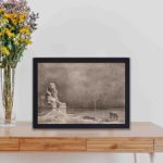 This vintage "Rest on the Flight to Egypt" print,displayed on a table with black frame