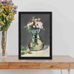 Elevate your home decor with Edouard Manet's "Moss Roses in a Vase." kept on a table with black frame