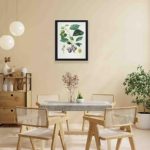 Infidu's vintage art print featuring a Prune Bifère fruit tree,hung on a yellow background wall with black frame