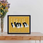 vintage art print of a traditional Japanese red-crowned crane flock by Ogata Korin, framed and placed on the table with black frame