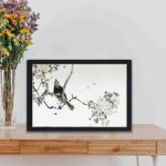 this exquisite vintage art print of a perched Japanese swallow by Watanabe Seitei,displayed on a table