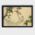 The playful charm of gossiping sparrows in this exquisite vintage art print,mounted on the wall