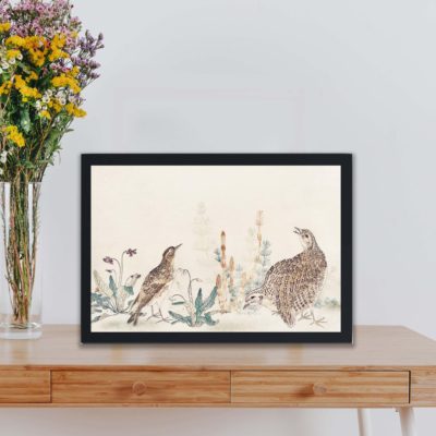 Vintage art print of "Uzura Hibari" by Utamaro Kitagawa,showcases quail and meadowlark birds with a poetic touch,displayed on a table.