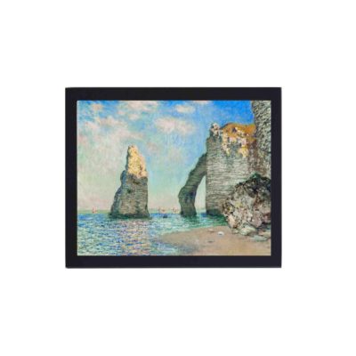 Vintage art print of Claude Monet's "The Cliffs at Étretat" (1885),mounted on the wall