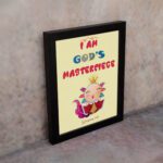 I Am God's Masterpiece wall art with a cartoon character and flowers, inspired by Ephesians 2:10, on a light yellow background. displayed on the wall in a black frame