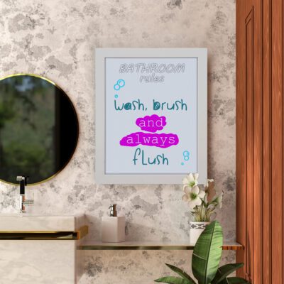 Wash, Brush, and Always Flush bathroom wall art with teal and pink bubble-style letters, blue bubbles, and light gray background. hung on the wall in the bathroom a white frame