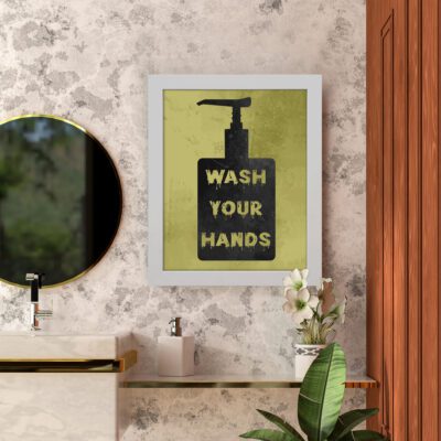 WASH YOUR HANDS bathroom wall art with a black soap dispenser, yellowish-green background, and bold white and yellow text for a modern look. hung on the wall in the bathroom a white frame